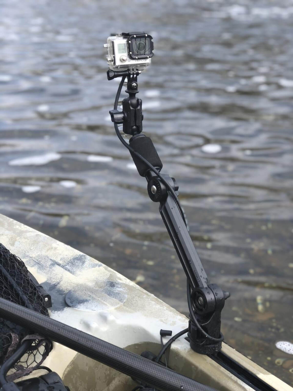 LOCKNLOAD 8" EXTENSION ARM WITH HARDWARE attached to a kayak with a GoPro attached