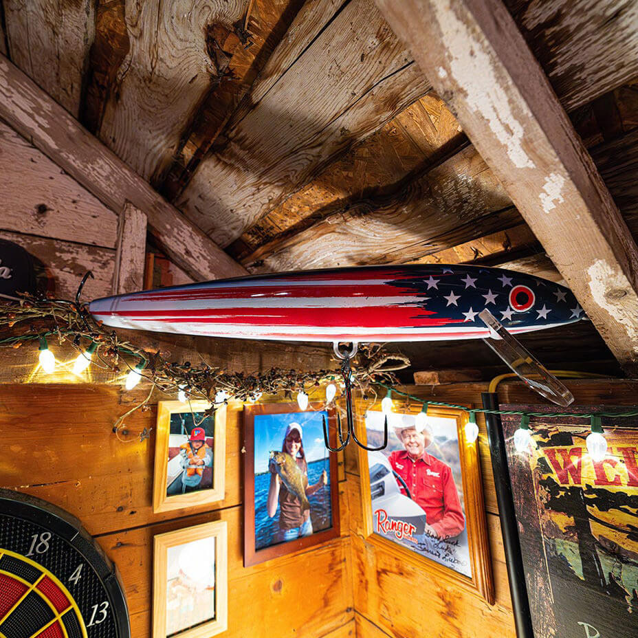 Rapala original giant 29" lure being displayed in a cabin for scale