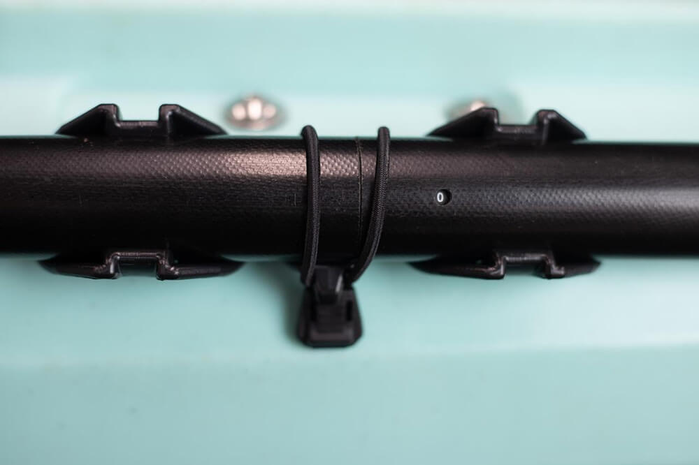 PADLOC PADDLE HOLDER mounted on a kayak with a paddle strapped on