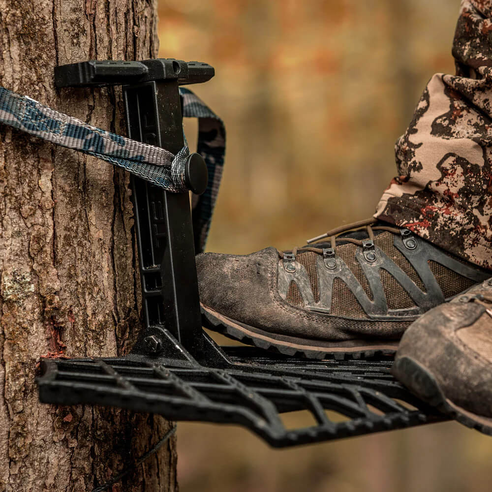 TETHRD PREDATOR V PLATFORM FOR SADDLE HUNTING attached to a tree
