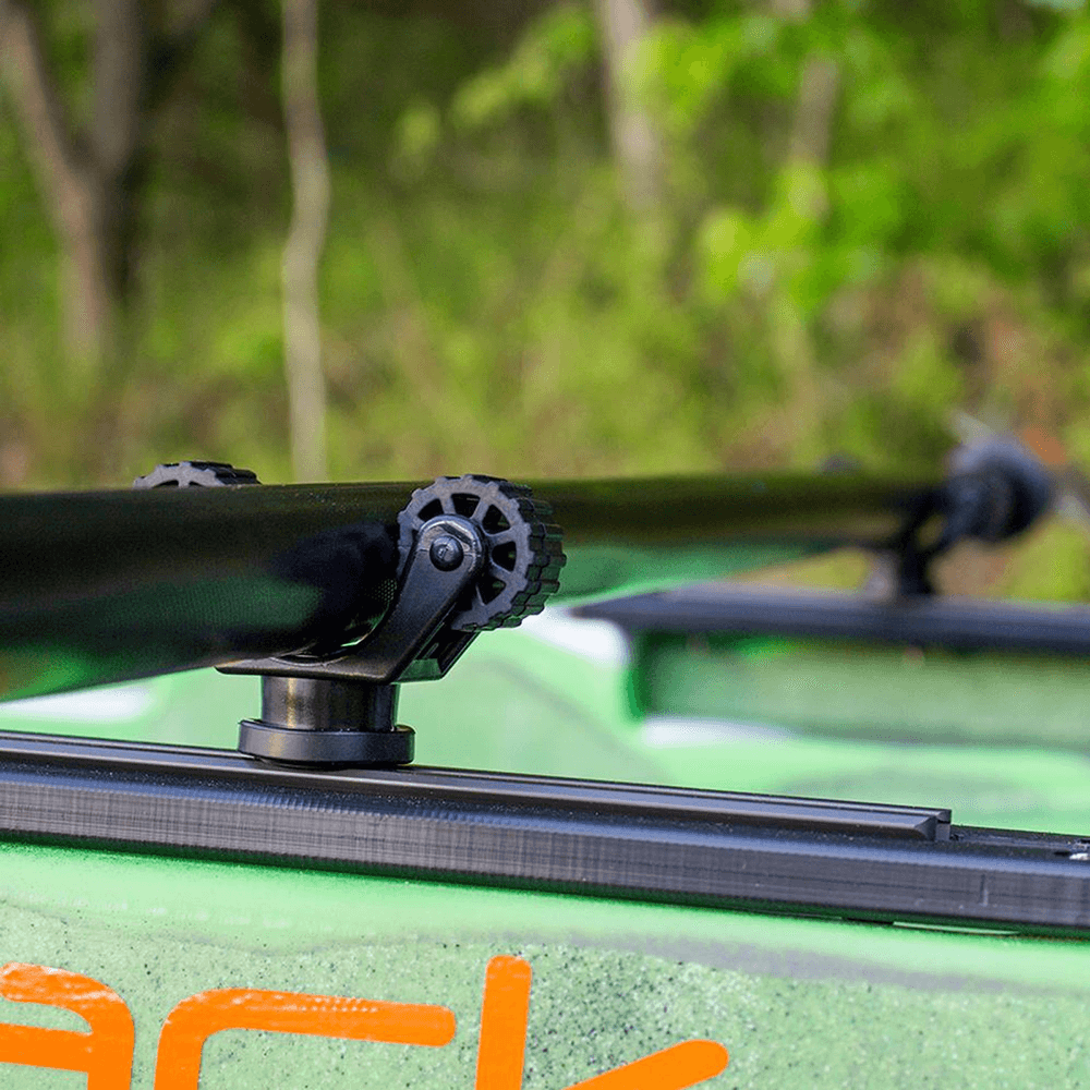 ROTOGRIP PADDLE HOLDER mounted on a kayak holding a paddle