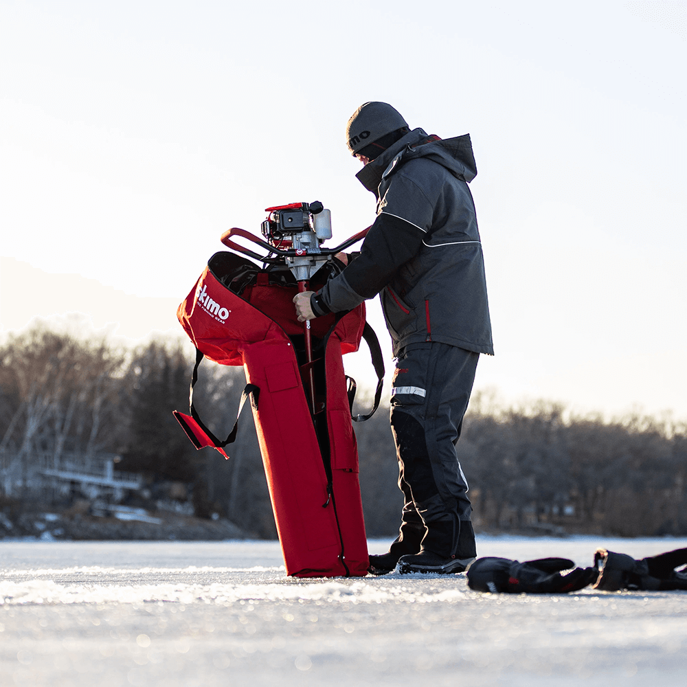 Taking an auger out of the eskimo ice auger carrying bag
