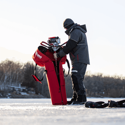 Taking an auger out of the eskimo ice auger carrying bag