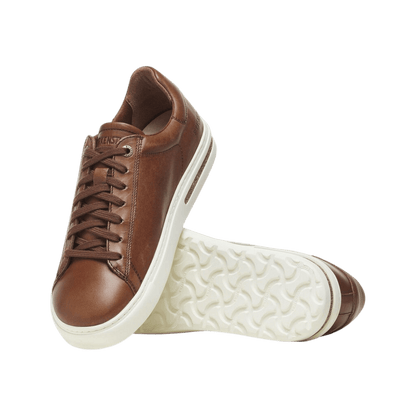 BIRKENSTOCK MEN'S BEND NATURAL LEATHER SNEAKER - COGNAC - FRONT ANGLED VIEW WITH SOLE DETAIL