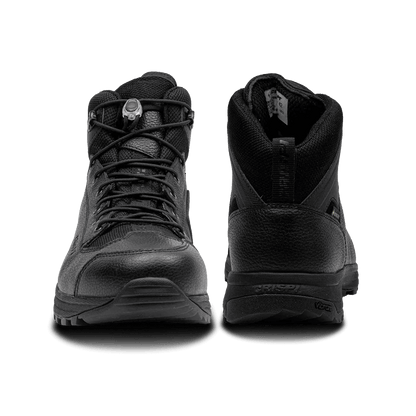 Black Crispi AT4 hiking boot with rugged outsole, leather upper, reinforced toe, and secure lace system. Designed for durability and all-terrain performance.