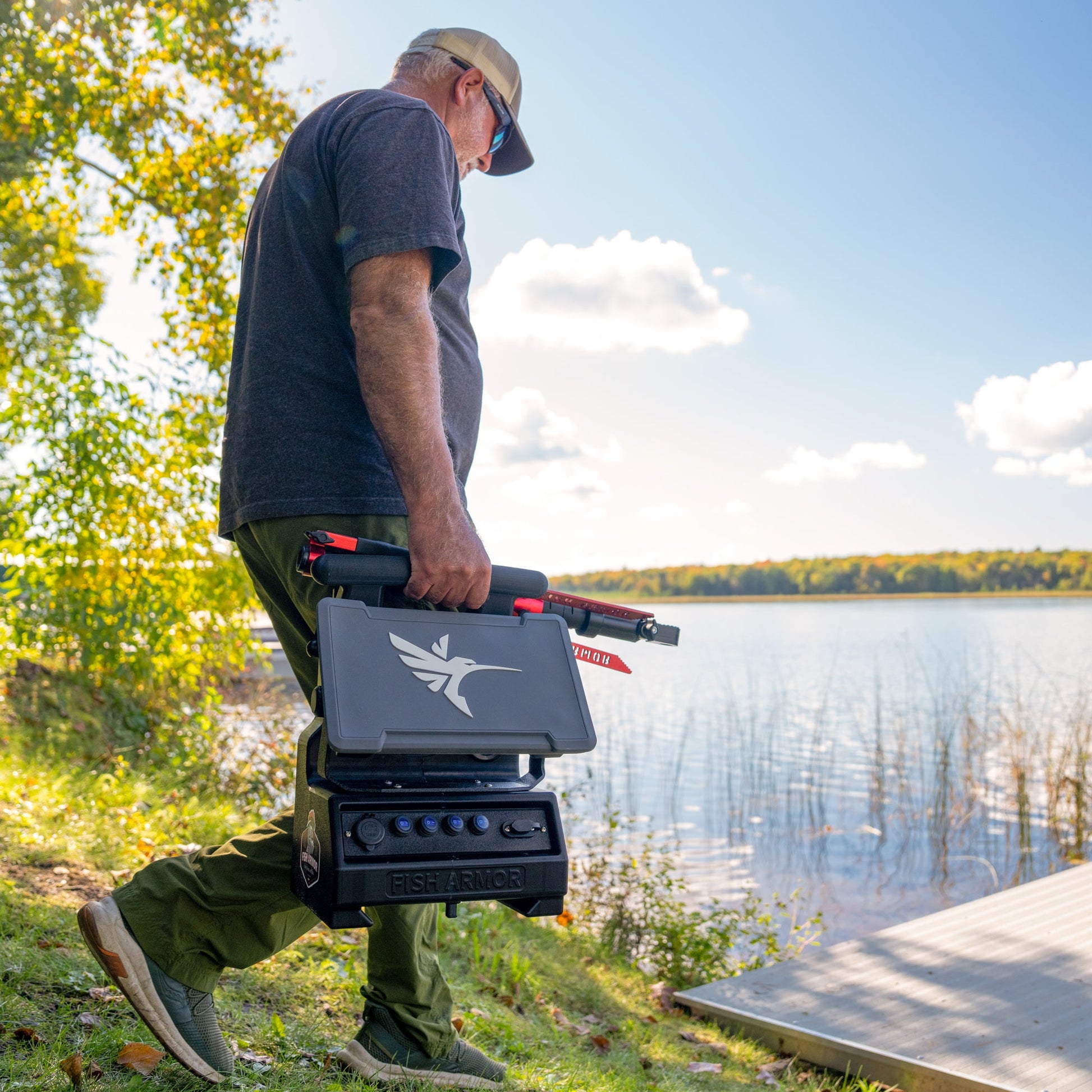 Fish Armor Pro Ultra Lite Shuttle with a man walking and holding the shuttle