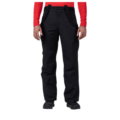 ROSSIGNOL MEN'S INSULATED SKI PANTS - BLACK - FRONT VIEW (IN USE)