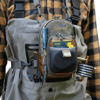 FISHPOND SAN JUAN VERTICAL CHEST PACK - SADDLE BROWN_FRONT ANGLE MODEL