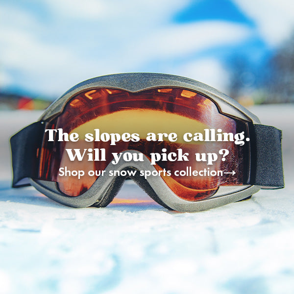 Snow goggles with text promoting our snow sports collection on a snowy background