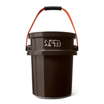 Brown YETI bucket with orange handle.