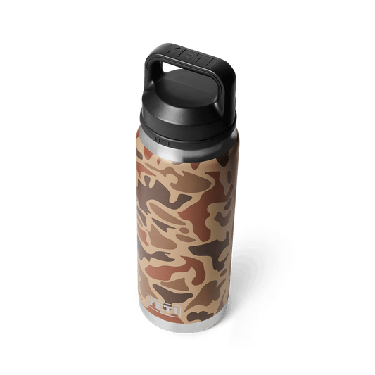 YETI Rambler 26 oz Bottle with Chug Cap in Wetlands Camo color pattern, featuring an abstract brown and tan camouflage design with a durable black lid and wide handle.