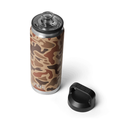 YETI Rambler 26 oz Bottle with Chug Cap in Wetlands Camo color pattern, featuring an abstract brown and tan camouflage design. With black lid off on the side.