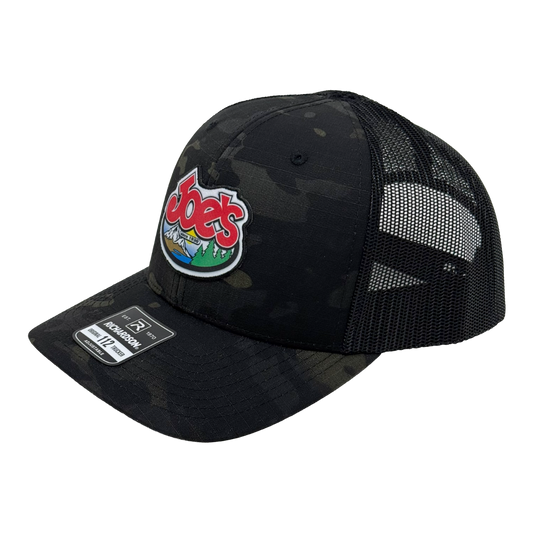 Black camouflage trucker hat with Joe's logo.