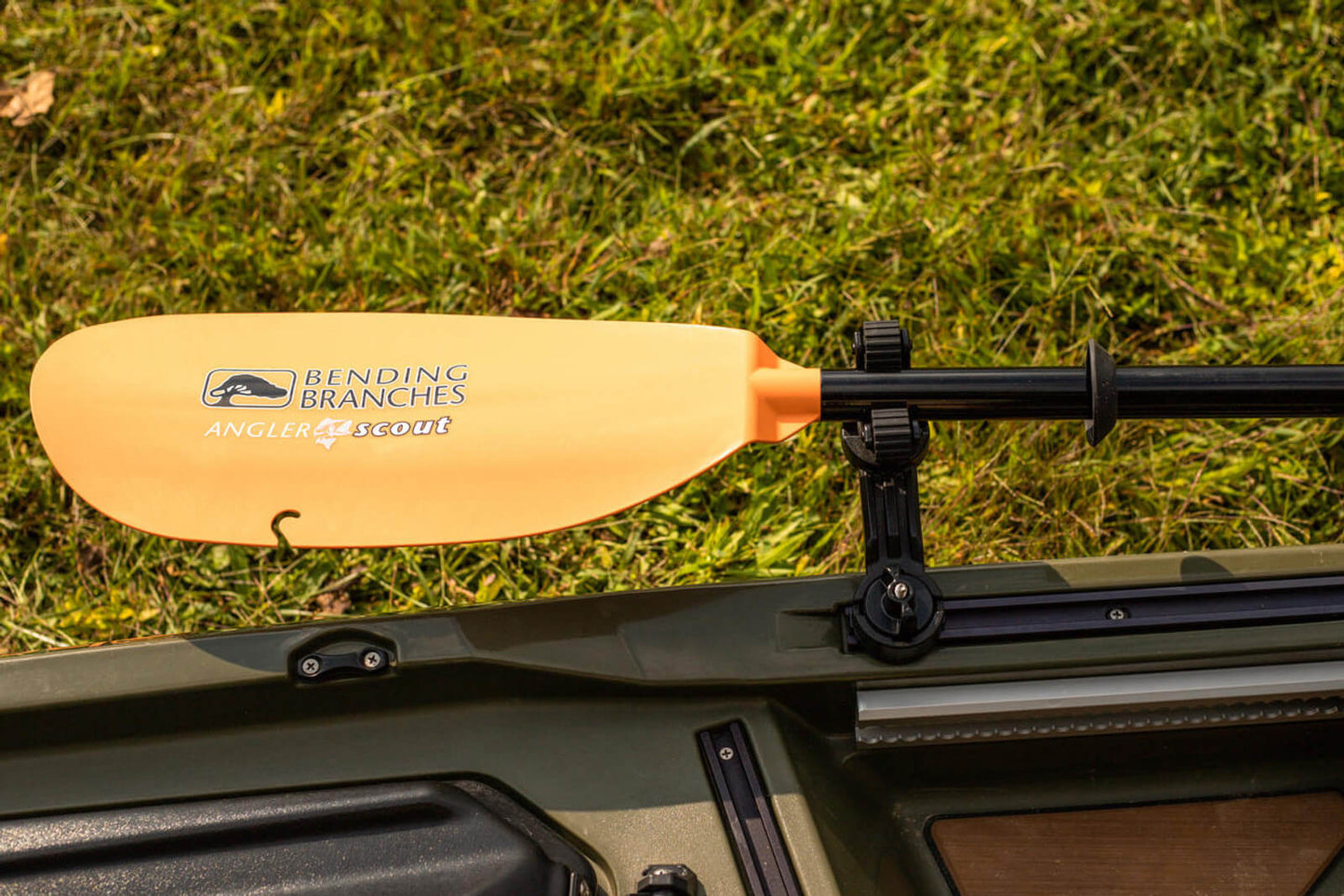 ROTOGRIP PADDLE HOLDER mounted and holding a paddle in a different position