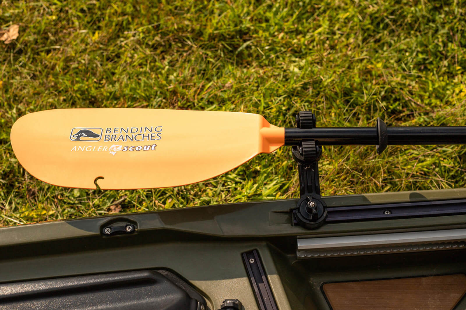 ROTOGRIP PADDLE HOLDER mounted and holding a paddle in a different position