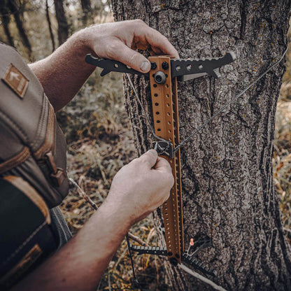 SKELETORS CLIMBING STICKS 4PK being installed on a tree.